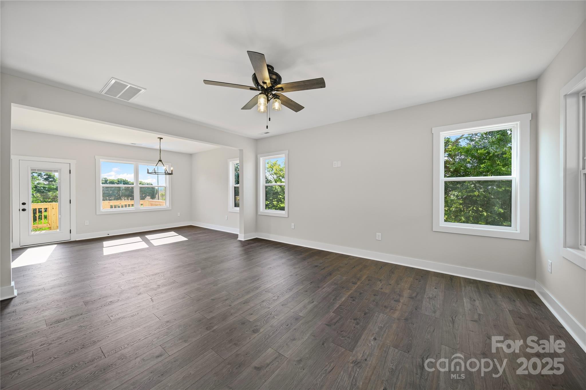 1308 Austin Chaney Road Wingate, NC 28174 - Photo 12 of 48 wooden floor in an empty room with a window