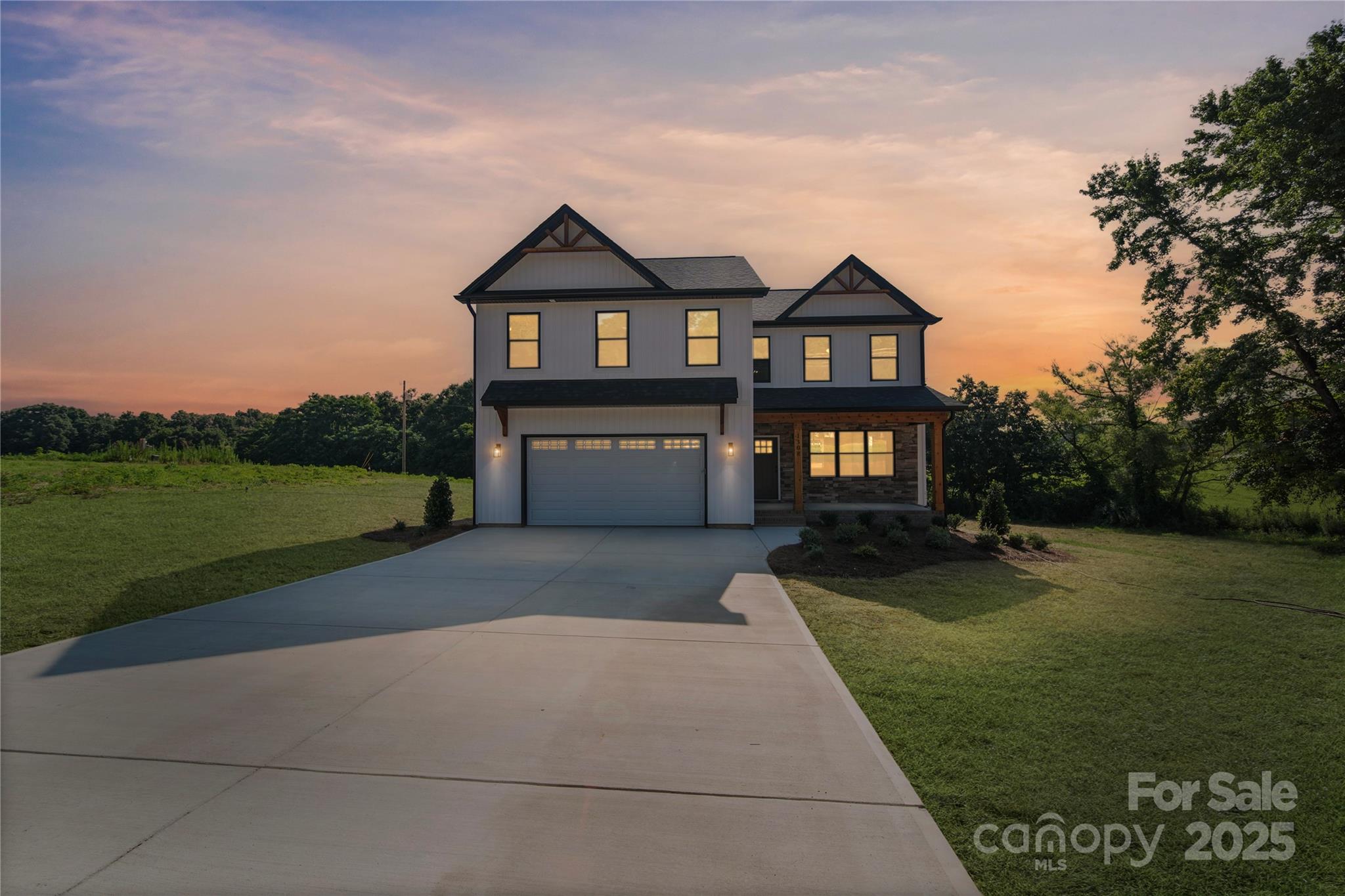 1308 Austin Chaney Road Wingate, NC 28174 - Photo 2 of 48 a front view of a house with garden