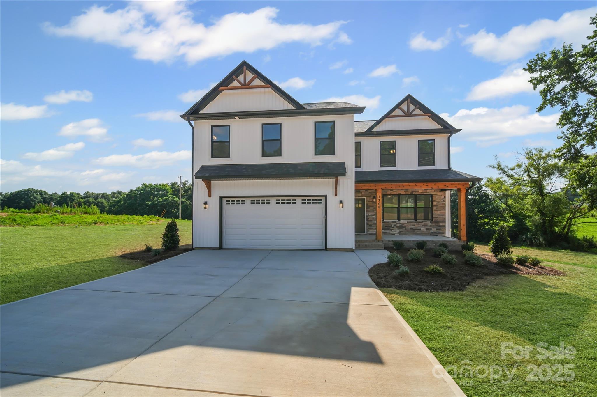 1308 Austin Chaney Road Wingate, NC 28174 - Photo 3 of 48 a front view of a house with a yard
