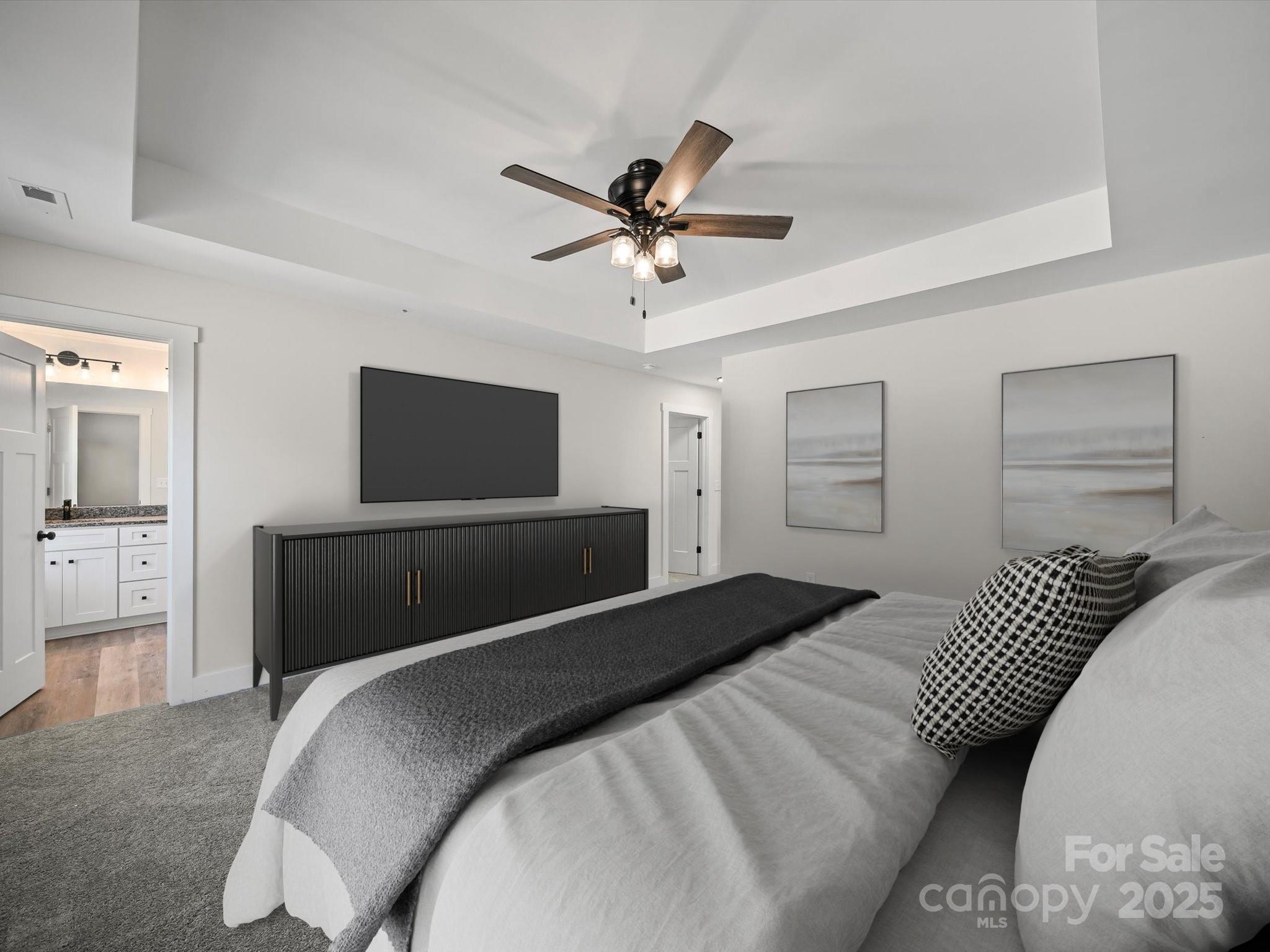 1308 Austin Chaney Road Wingate, NC 28174 - Photo 33 of 48 a bedroom with a bed and a flat screen tv
