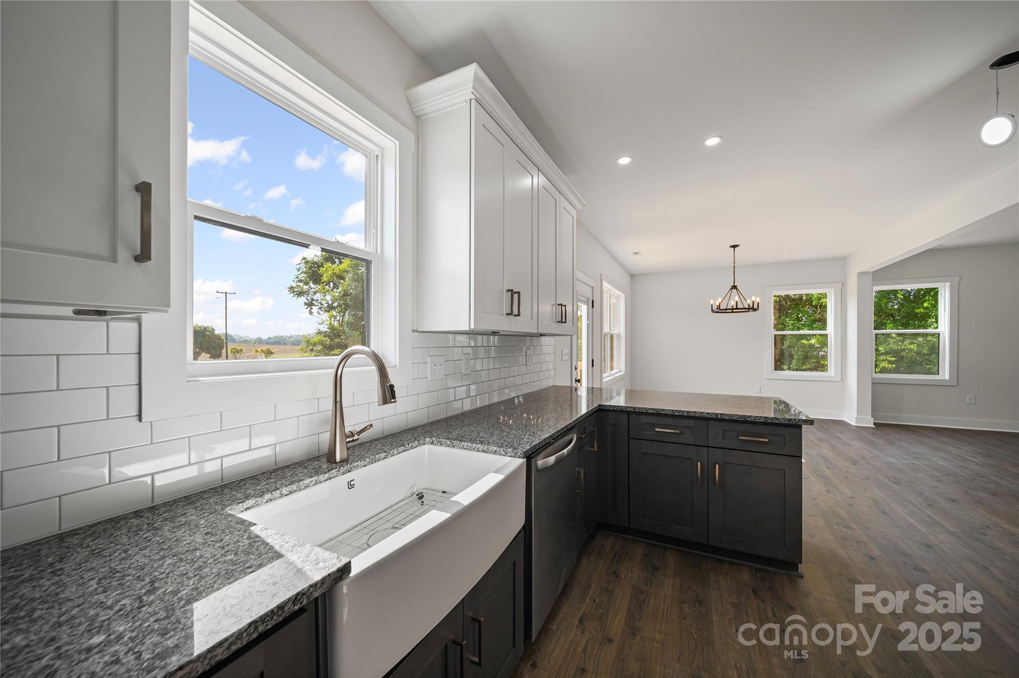 1308 Austin Chaney Road Wingate, NC 28174 - Photo 6 of 48 a kitchen with granite countertop a sink a counter top space and cabinets