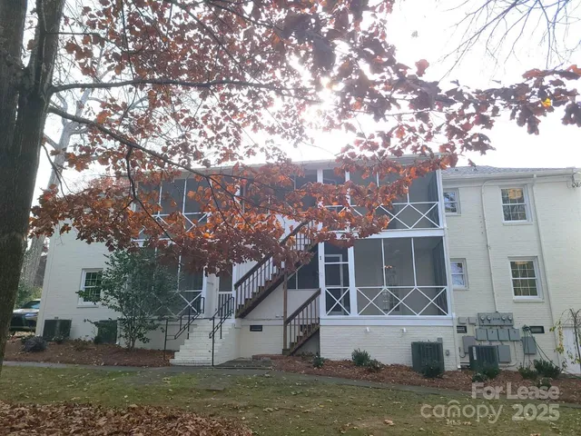 a view of house with a yard
