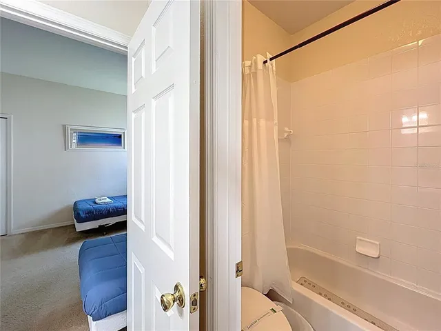 a bathroom with a tub and shower
