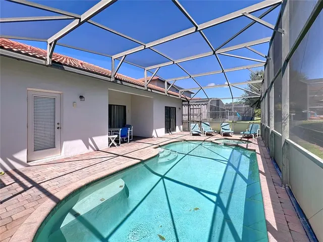 a view of a backyard with a table and chairs
