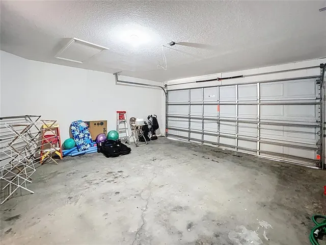 a view of a garage with rack and bicycle
