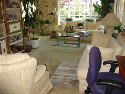 210 Olympic Way, Unit 210 San Rafael, CA 94903 - Photo 4 of 10 a living room with fireplace furniture and a large window
