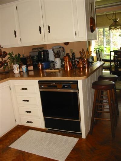 210 Olympic Way, Unit 210 San Rafael, CA 94903 - Photo 8 of 10 a kitchen with appliances cabinets and a counter top space