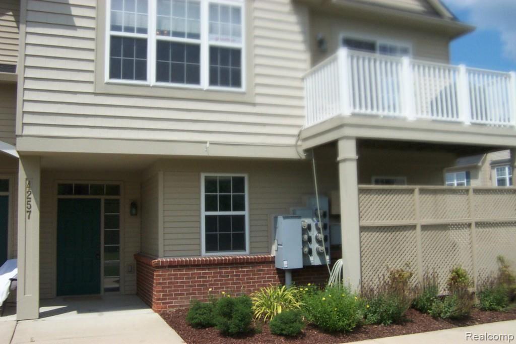 4257 Hampton Ridge Boulevard, Unit 132 Howell, MI 48843 - Photo 2 of 22 entrance, balcony, landscaping
