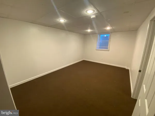 an empty room with a hallway