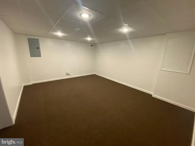 an empty room with a empty space and windows