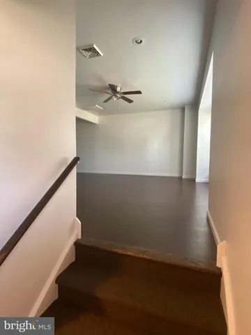 a backyard of a house with a yard and outdoor seating