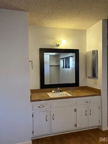 a view of an empty room with a ceiling fan