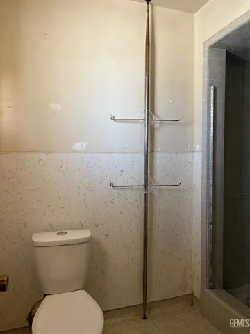 a view of a hallway with wooden shelves
