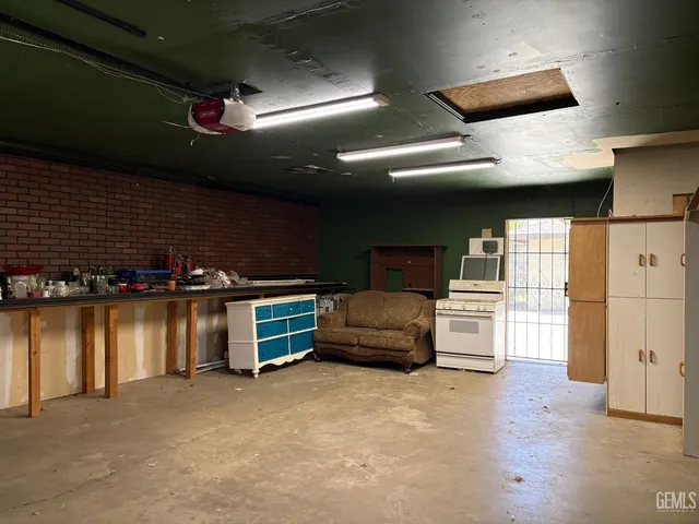 a view of a house with wooden fence