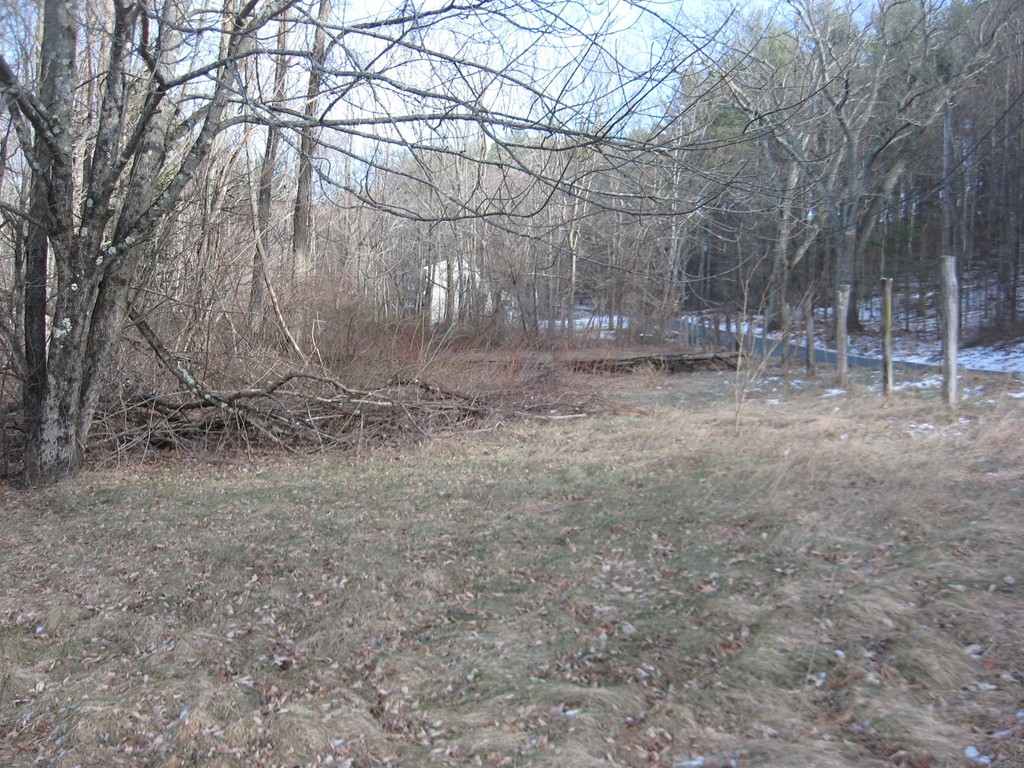 Lot 22 Bacon Road Ware, MA 01082 - Photo 4 of 5 a backyard of a house with lots of green space and fog