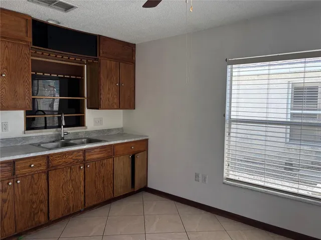 a kitchen with a sink and a window