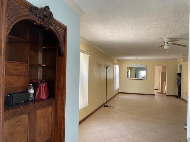 a view of a livingroom with closet and a window