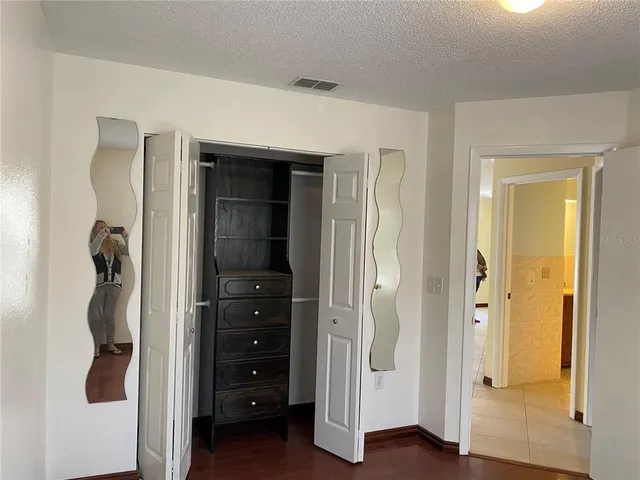 a view of a house with backyard porch and sitting area