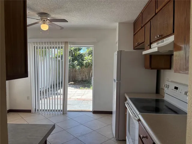 a kitchen with a stove and a refrigerator