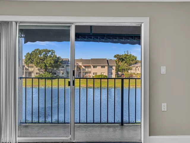 a view of swimming pool from a balcony
