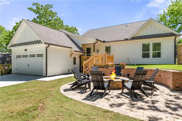 a view of a house with outdoor space and sitting area