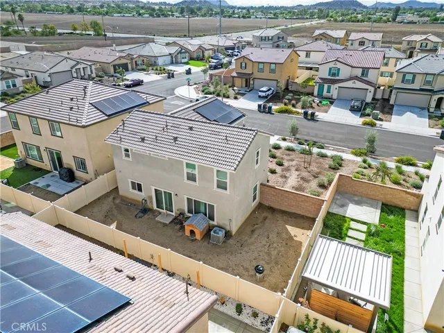 an aerial view of a house with a garden