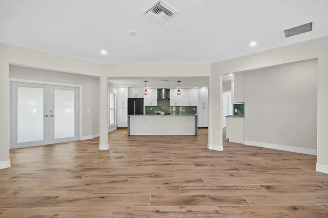 a view of kitchen with wooden floor and window