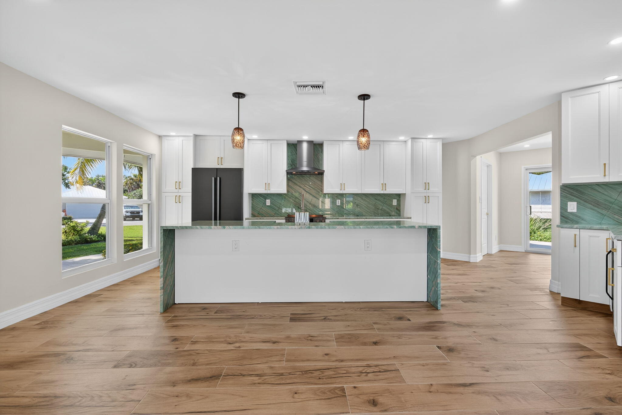 5273 Southeast Tall Pines Way Stuart, FL 34997 - Photo 20 of 62 a view of kitchen with wooden floor and window
