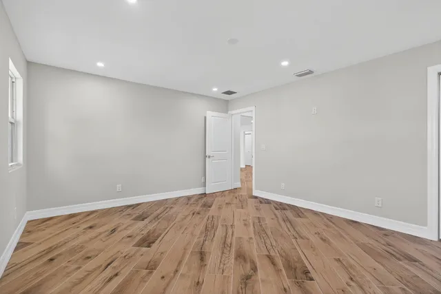 a bathroom with a granite countertop sink mirror and double