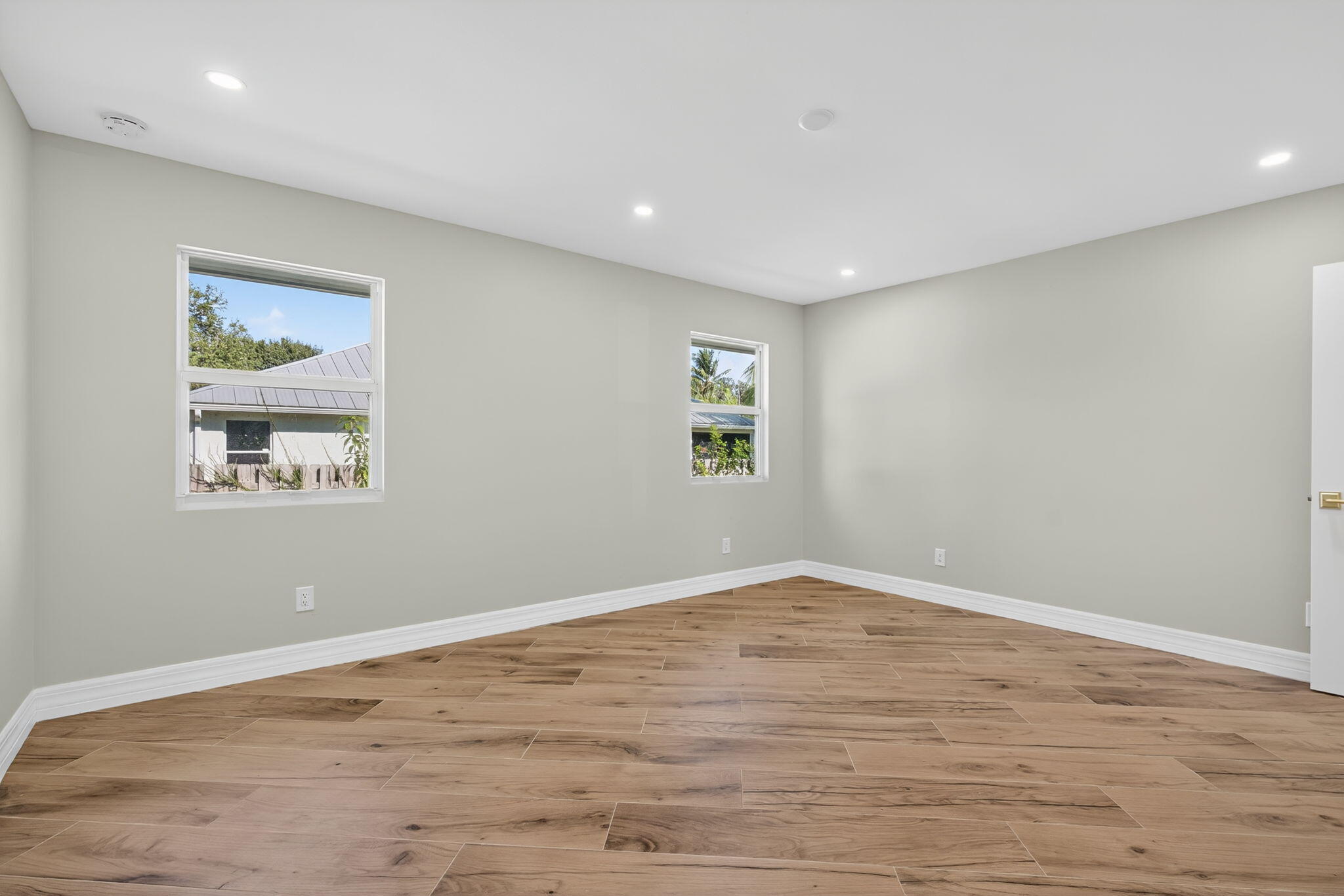 5273 Southeast Tall Pines Way Stuart, FL 34997 - Photo 31 of 62 a view of empty room with wooden floor and fan