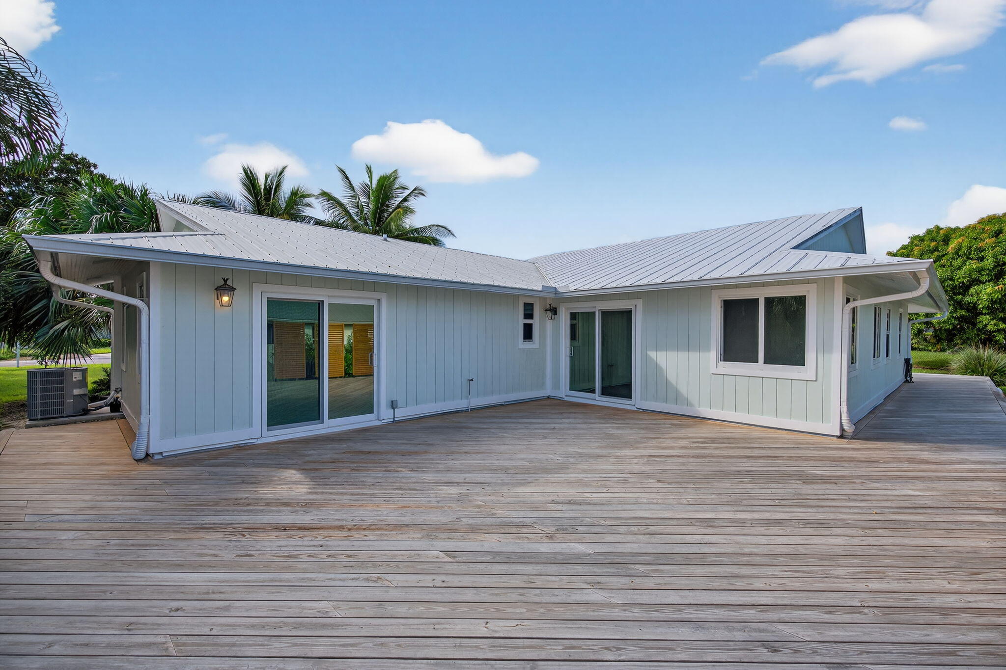 5273 Southeast Tall Pines Way Stuart, FL 34997 - Photo 51 of 62 a view of a house with a backyard and plants