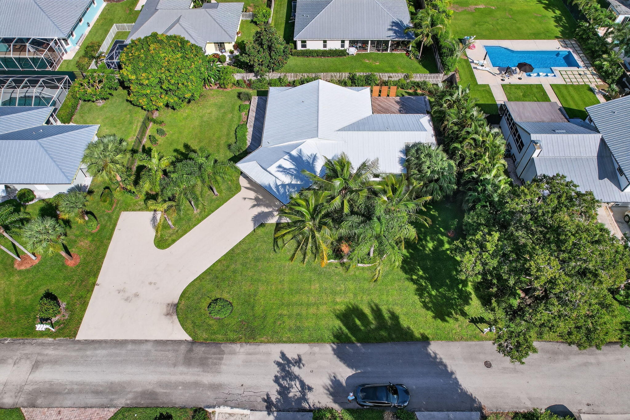 5273 Southeast Tall Pines Way Stuart, FL 34997 - Photo 58 of 62 an aerial view of a house with a yard and a garden