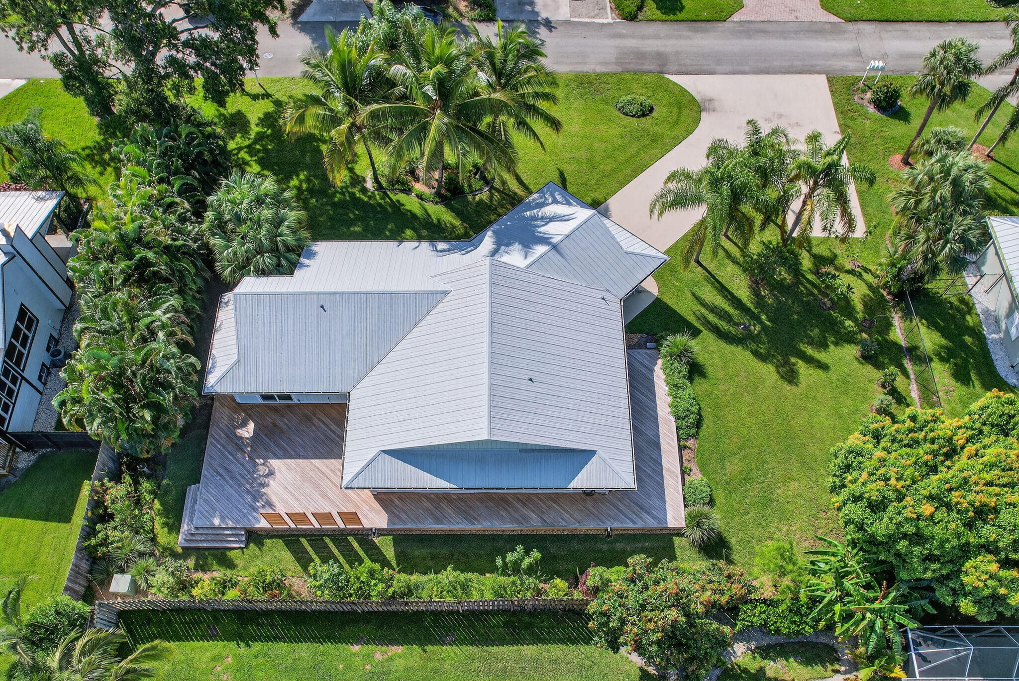 5273 Southeast Tall Pines Way Stuart, FL 34997 - Photo 59 of 62 an aerial view of a house with a yard and potted plants