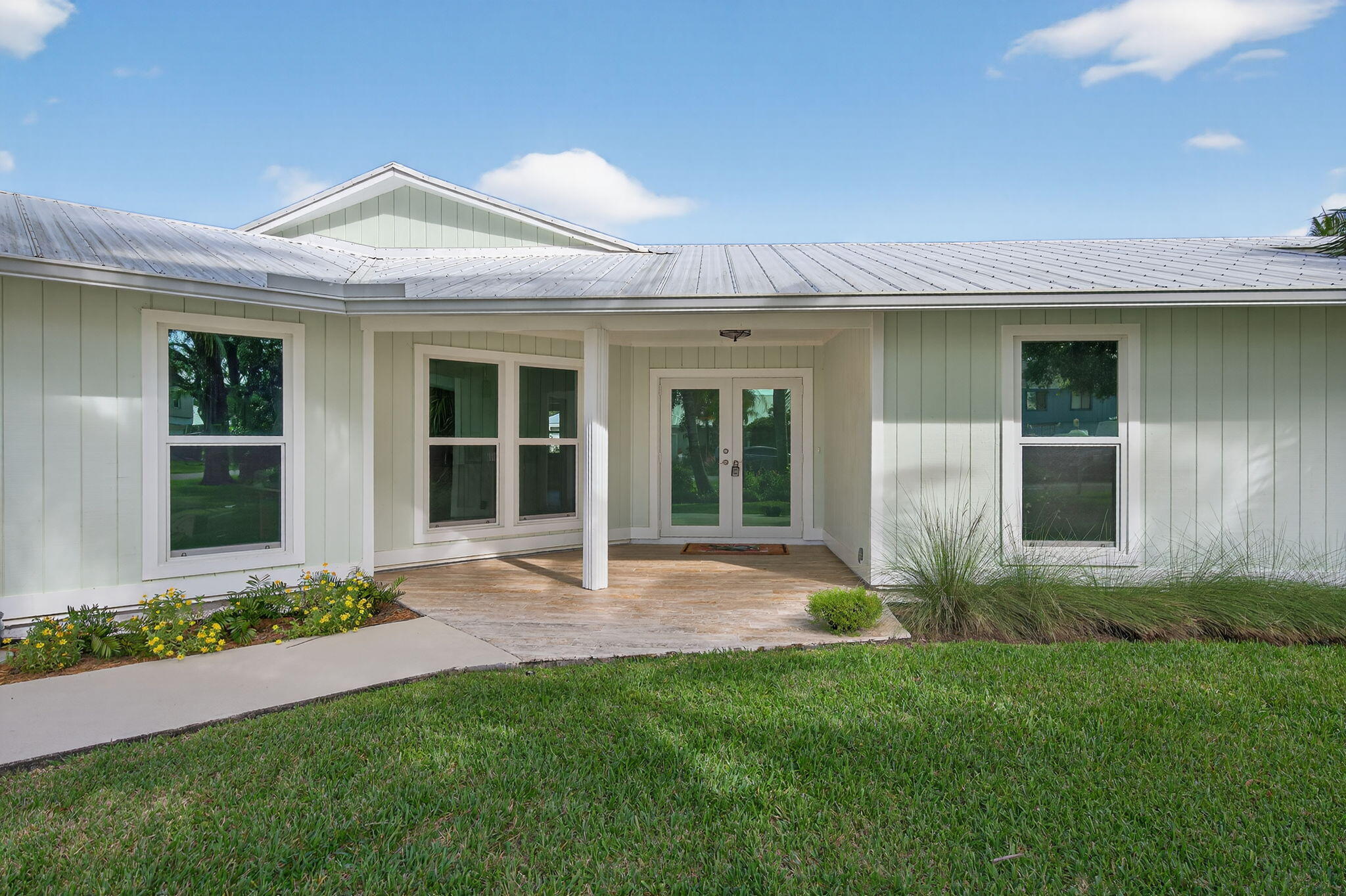 5273 Southeast Tall Pines Way Stuart, FL 34997 - Photo 8 of 62 front view of a house with a yard