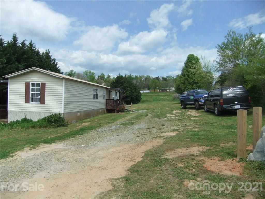 553 Parris Road Rutherfordton, NC 28139 - Photo 2 of 23 a front view of a house with garden