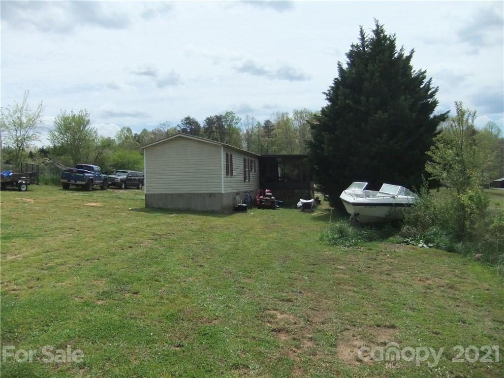 553 Parris Road Rutherfordton, NC 28139 - Photo 11 of 23 a backyard of a house with a yard and seating space