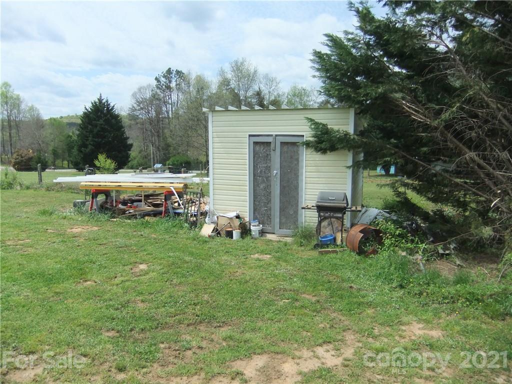 553 Parris Road Rutherfordton, NC 28139 - Photo 13 of 23 a backyard of a house with table and chairs