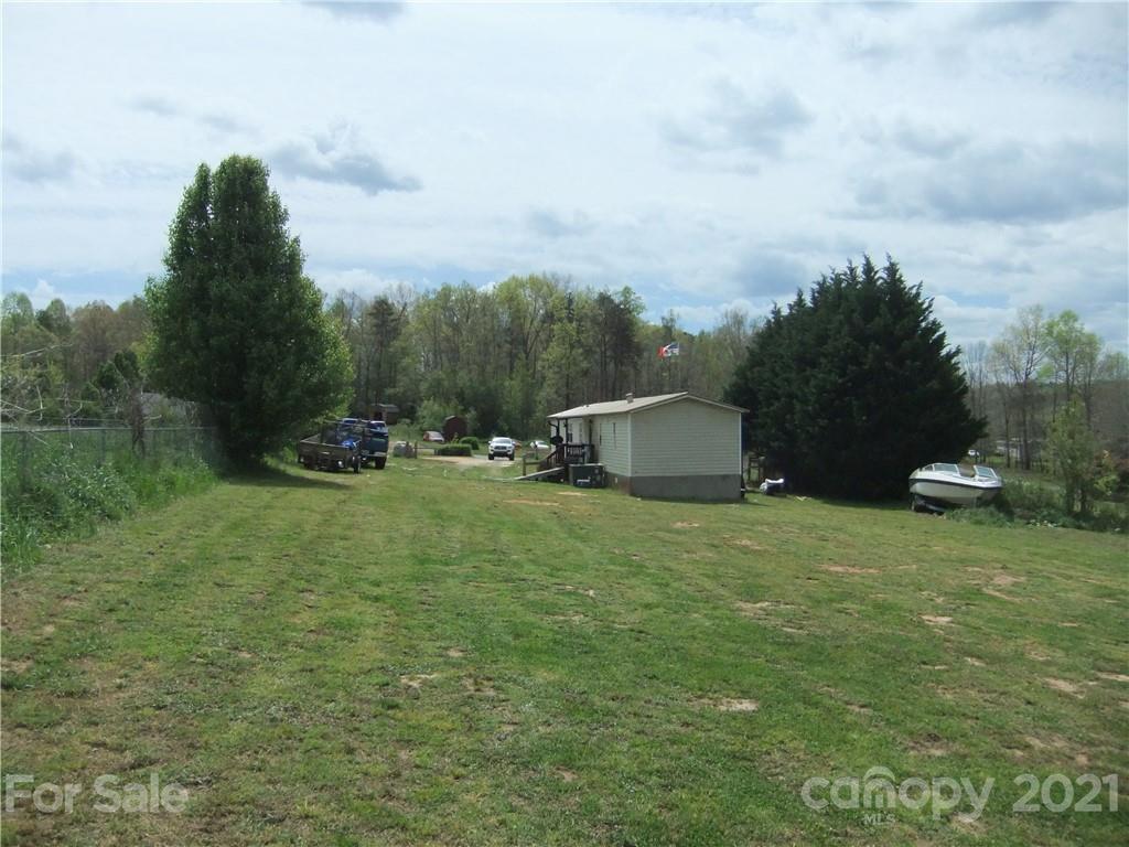 553 Parris Road Rutherfordton, NC 28139 - Photo 15 of 23 a backyard of a house with table and chairs