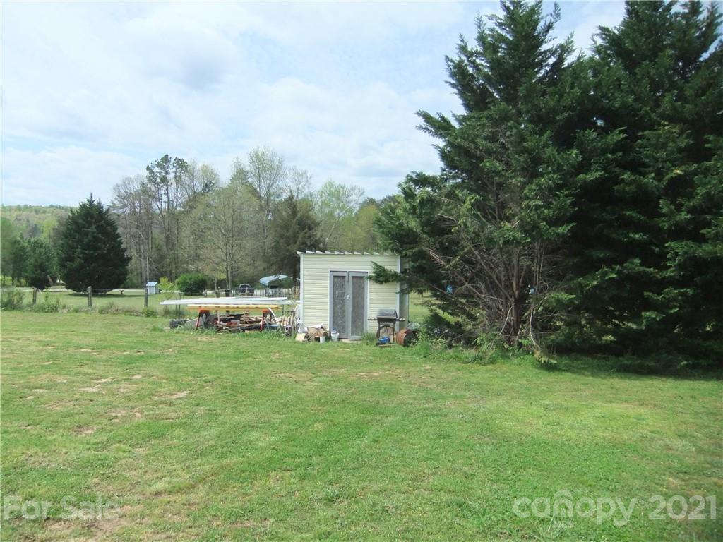 553 Parris Road Rutherfordton, NC 28139 - Photo 16 of 23 a backyard of a house with table and chairs