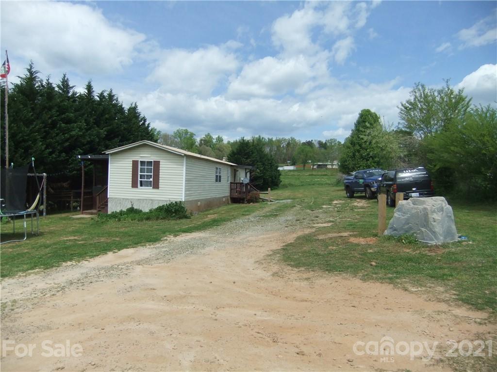 553 Parris Road Rutherfordton, NC 28139 - Photo 4 of 23 a view of a house with backyard and a garden