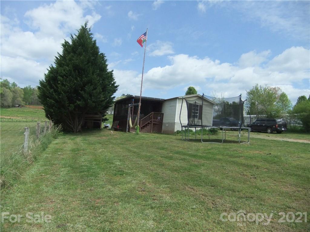 553 Parris Road Rutherfordton, NC 28139 - Photo 6 of 23 a front view of a house with garden