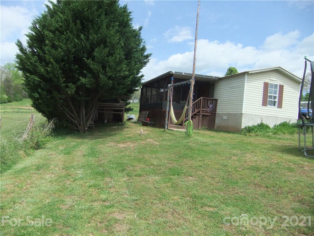 553 Parris Road Rutherfordton, NC 28139 - Photo 7 of 23 a house view with a garden space