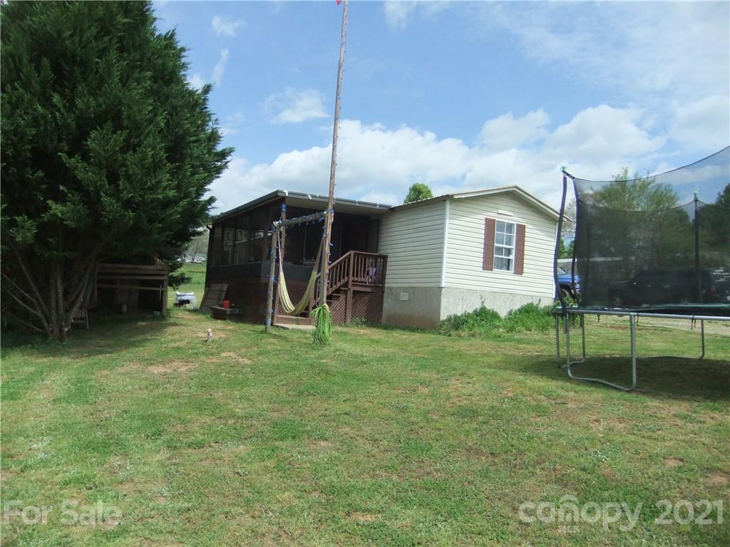 553 Parris Road Rutherfordton, NC 28139 - Photo 8 of 23 a view of a chair and table in backyard of the house
