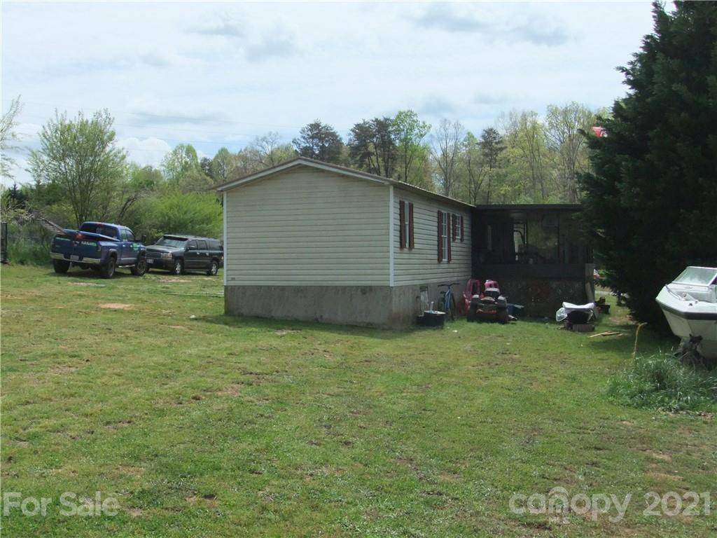 553 Parris Road Rutherfordton, NC 28139 - Photo 10 of 23 a backyard of a house with table and chairs