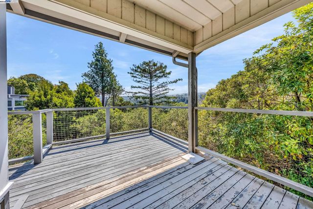 a view of a balcony with wooden floor