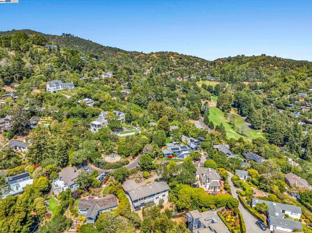 view of a mountain range in a cloudy sky