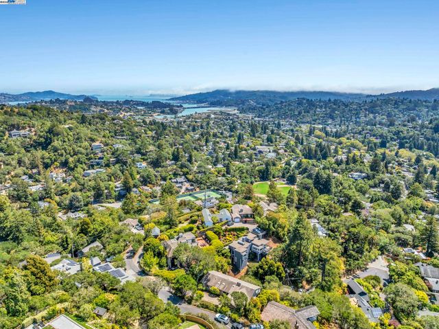 an aerial view of houses with yard