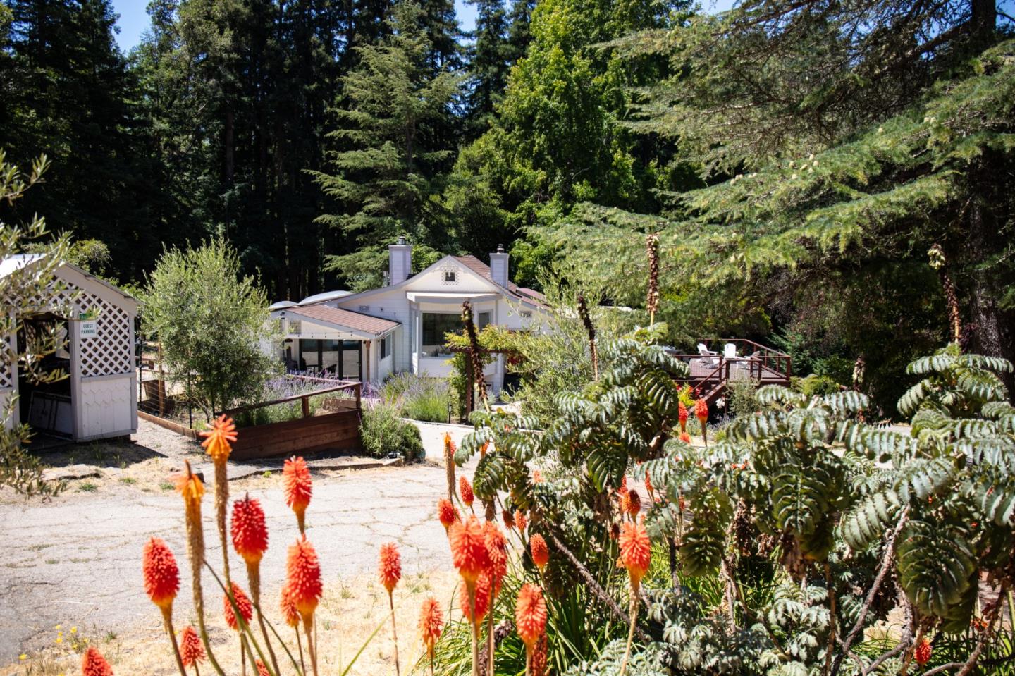 1003 Laurel Glen Road Soquel, CA 95073 - Photo 4 of 101 a front view of a house with a yard and sitting area