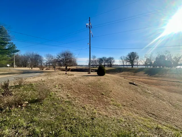 a view of a road with a building in the background
