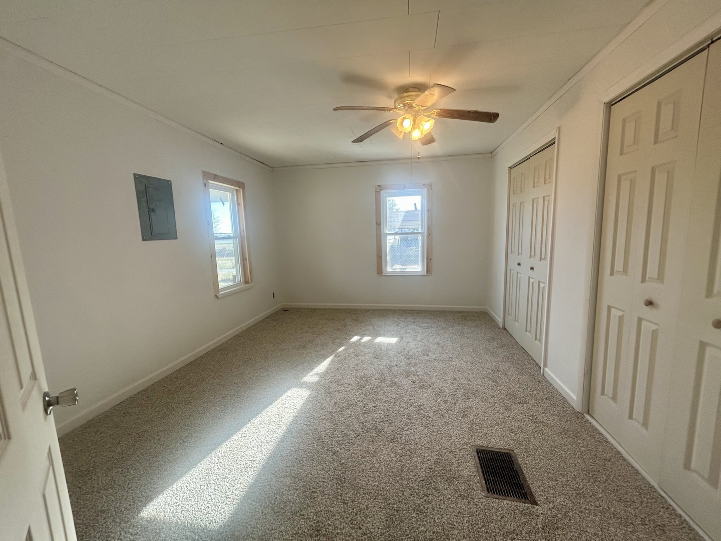 207 Butler Street Metropolis, IL 62960 - Photo 22 of 28 a view of an empty room with chandelier and window